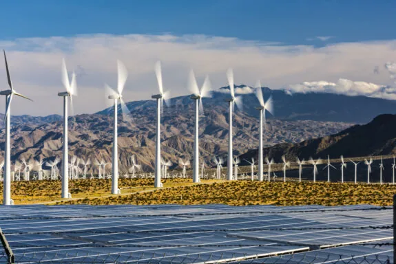 A row of wind turbines on a wind farm
